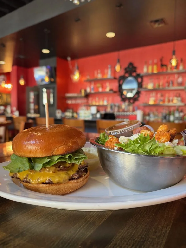 A burger and salad at Pat & Gracies, a restaurant in Downtown Columbus near Ohio Theatre.